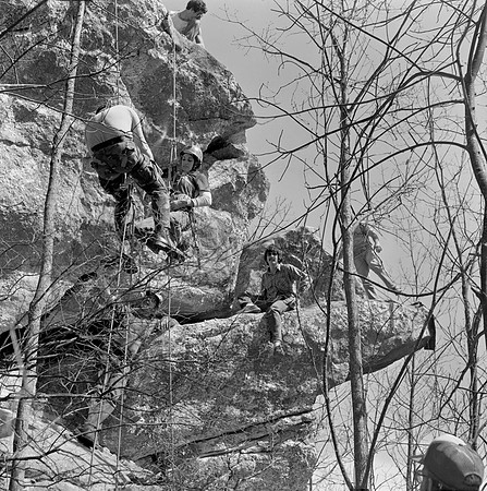 Diane Cousineau on rope, William Bagwell sitting on ledge